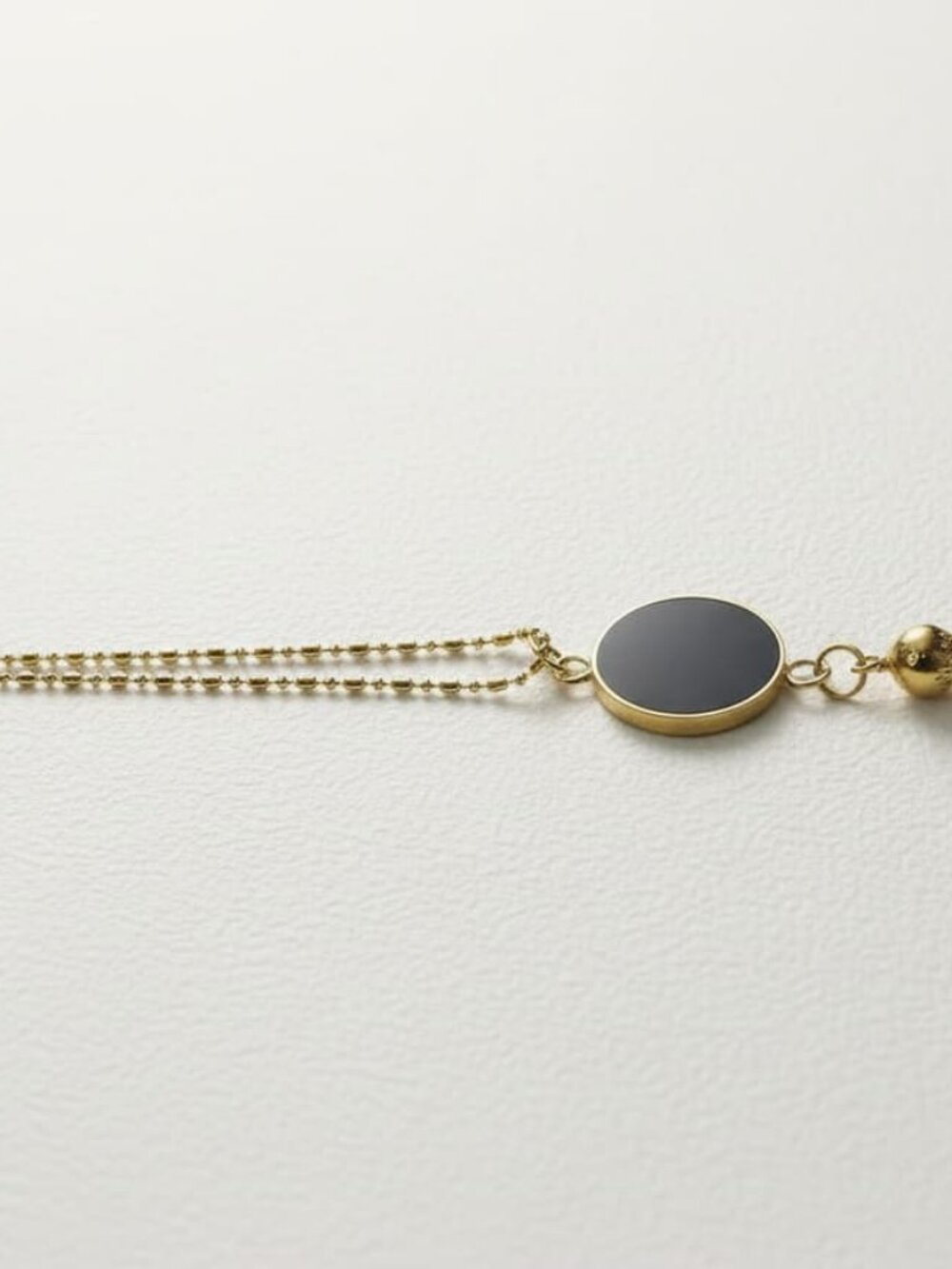 Brass-Plated Persian Style Pomegranate Necklace with Black Enamel Disc